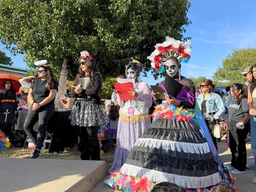 Catrinas in full costume, scored by judges at the Catrina contest